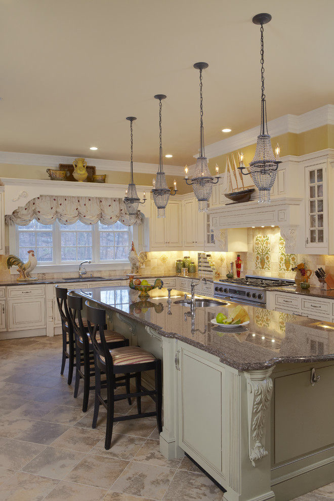 Eat-in kitchen - large traditional l-shaped eat-in kitchen idea in New York with an undermount sink, raised-panel cabinets, granite countertops, beige backsplash, stone tile backsplash, stainless steel appliances and an island