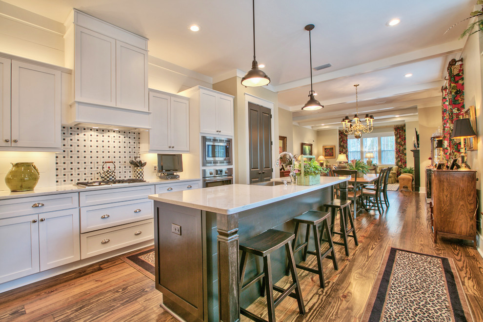This is an example of a large traditional l-shaped kitchen/diner in Atlanta with an island.