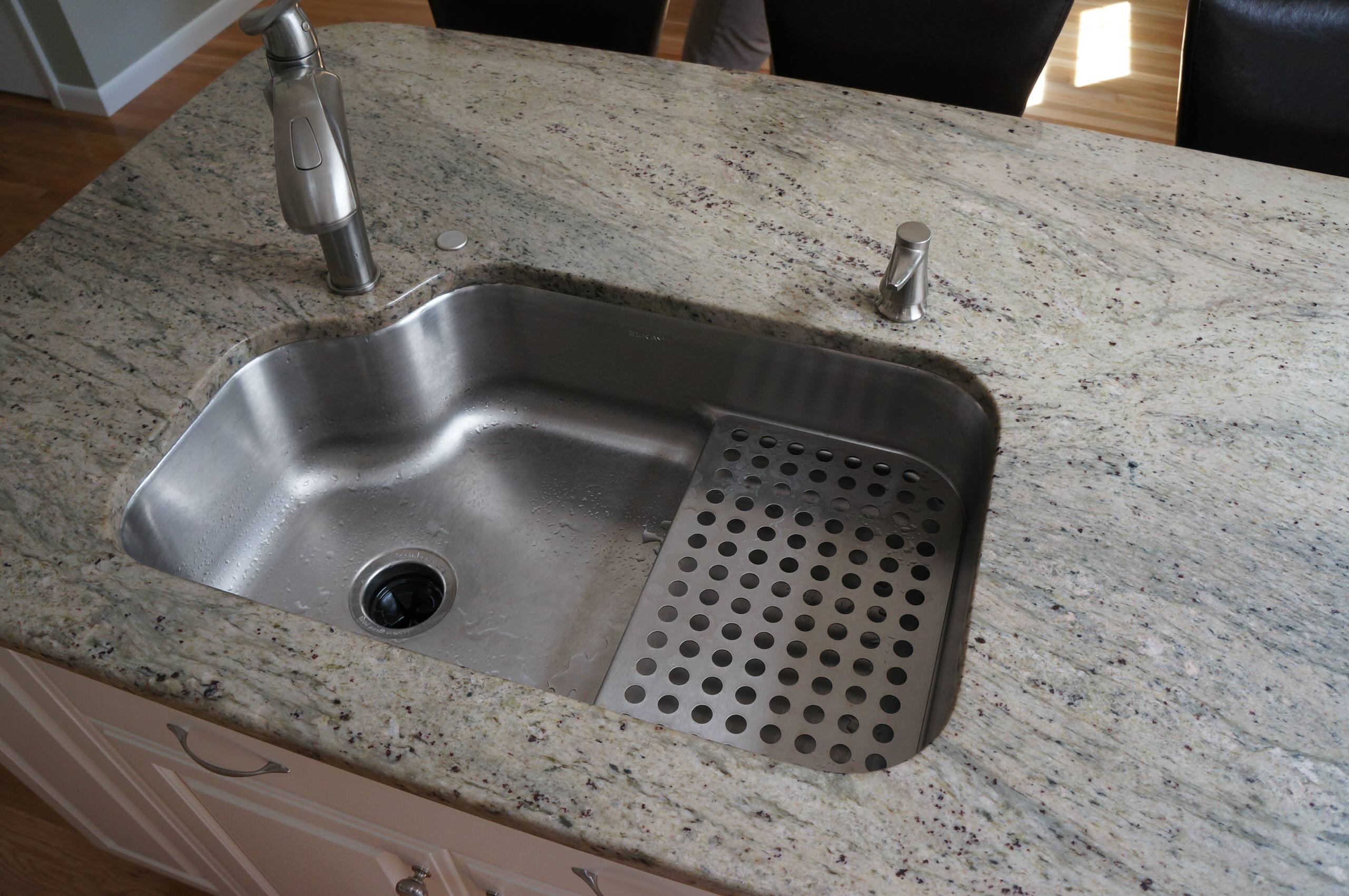 Custom, in-cabinet dish drying rack. Water drips directly into the sink. -  Transitional - Kitchen - Seattle - by Genay Bell Interior Design