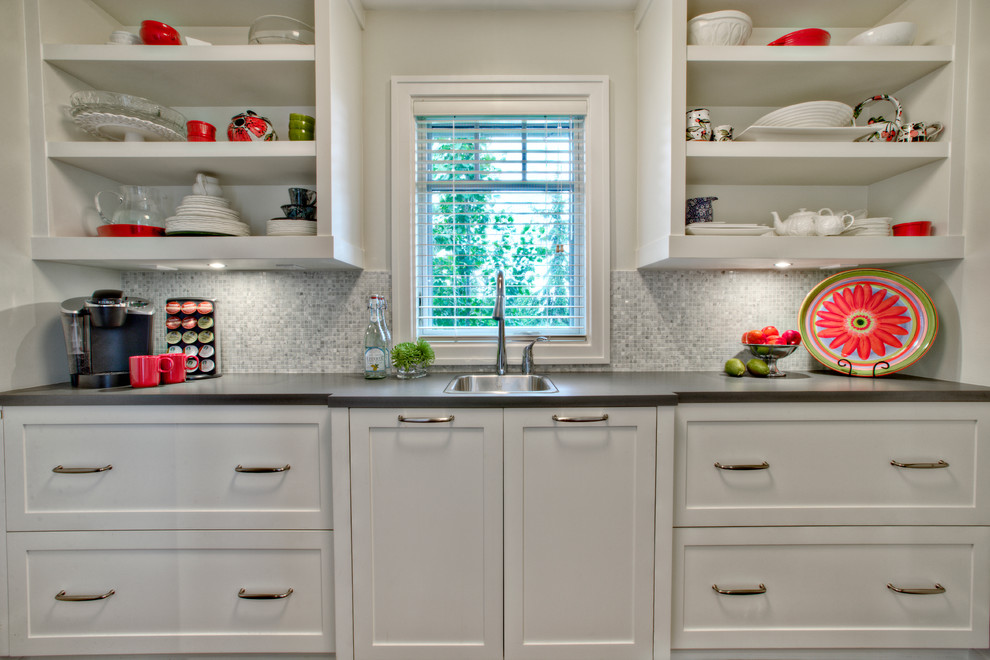 Photo of a traditional kitchen in Calgary with a built-in sink, open cabinets, white cabinets, grey splashback and mosaic tiled splashback.