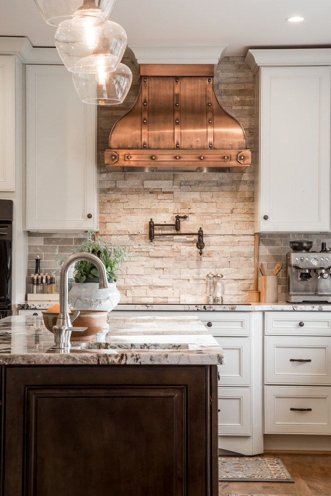 Kitchen - traditional kitchen idea in Tampa with beige backsplash and stone tile backsplash