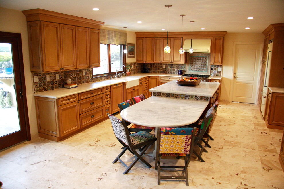 Example of a tuscan kitchen design in Santa Barbara with multicolored backsplash