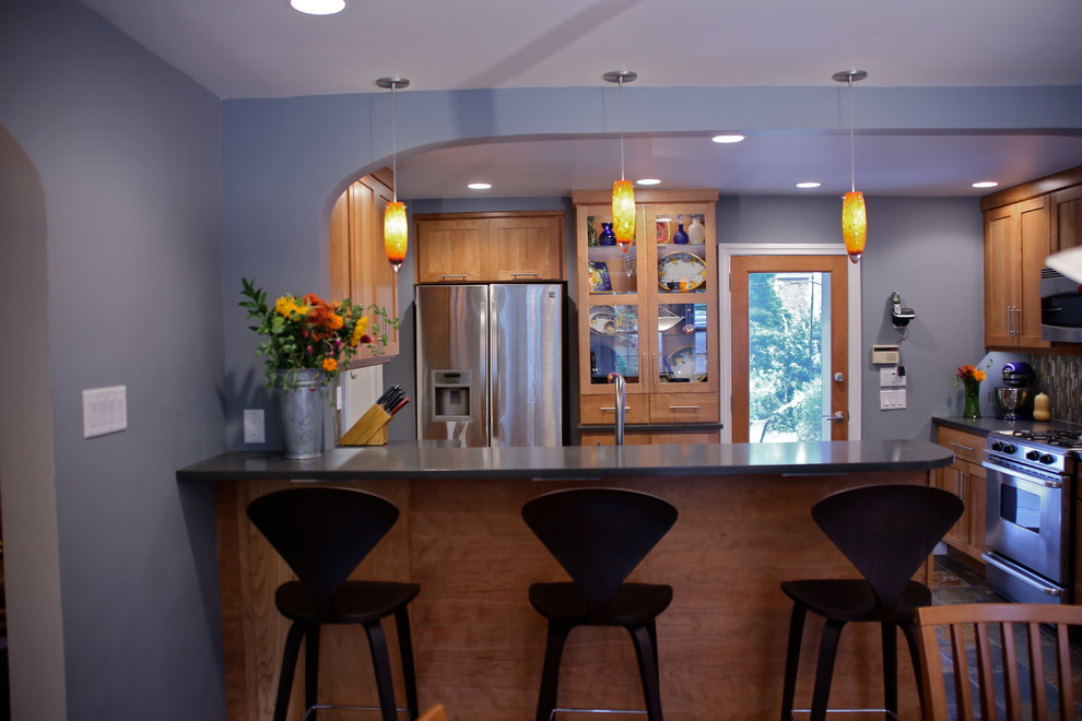 Eat-in kitchen - small transitional l-shaped slate floor eat-in kitchen idea in Philadelphia with an undermount sink, shaker cabinets, light wood cabinets, quartz countertops, multicolored backsplash, glass tile backsplash and stainless steel appliances