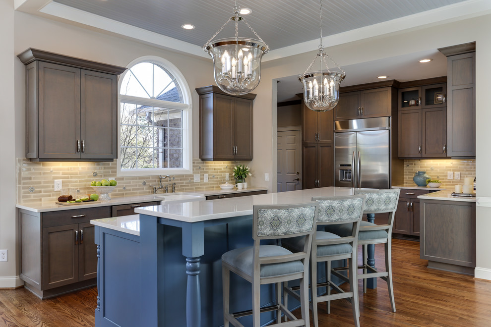 Kitchen - traditional kitchen idea in Raleigh with dark wood cabinets and an island