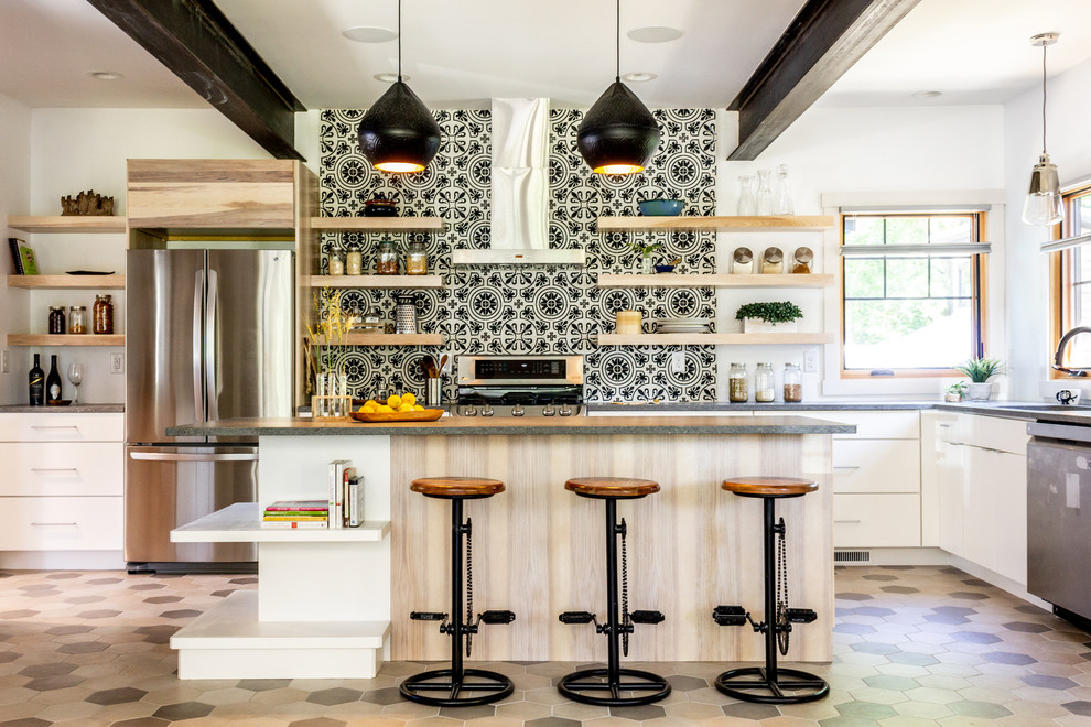 This is an example of a large traditional open plan kitchen in Other with flat-panel cabinets, white cabinets, engineered stone countertops, multi-coloured splashback, cement tile splashback, stainless steel appliances, ceramic flooring, an island, multi-coloured floors, grey worktops and a submerged sink.