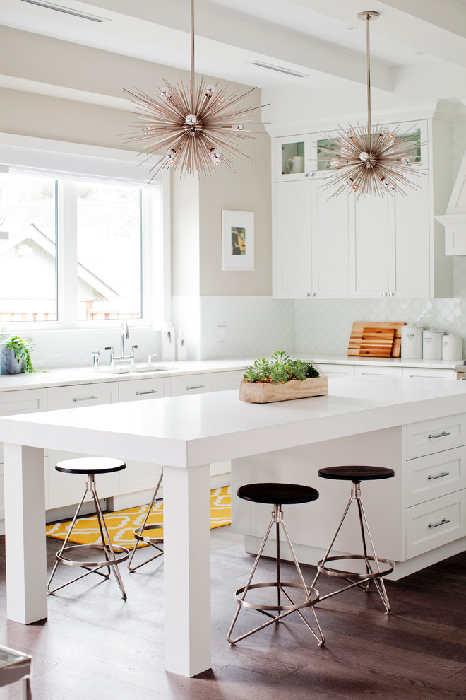 Medium sized classic u-shaped kitchen/diner in Vancouver with a submerged sink, shaker cabinets, white cabinets, white splashback, dark hardwood flooring, an island, marble worktops, mosaic tiled splashback and integrated appliances.