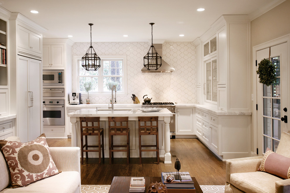 Inspiration for a transitional l-shaped open concept kitchen remodel in Atlanta with white cabinets