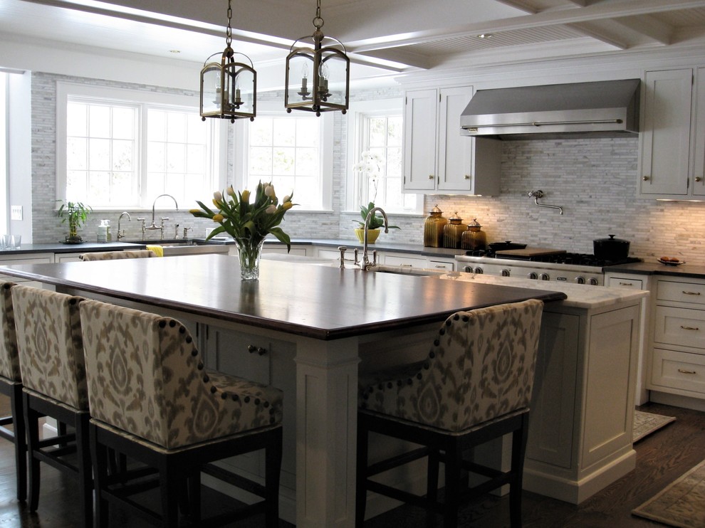 Inspiration for a large timeless u-shaped dark wood floor and brown floor enclosed kitchen remodel in New York with a farmhouse sink, shaker cabinets, white cabinets, concrete countertops, beige backsplash, matchstick tile backsplash, stainless steel appliances, an island and gray countertops