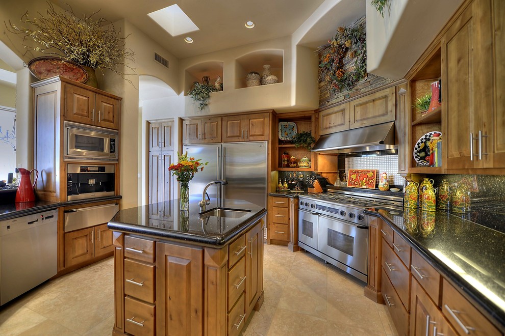 Design ideas for a large classic u-shaped open plan kitchen in Phoenix with medium wood cabinets, stainless steel appliances and a submerged sink.
