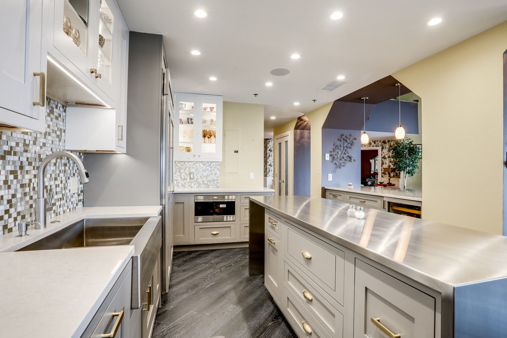 Inspiration for a large transitional enclosed kitchen remodel in Baltimore with a farmhouse sink, mosaic tile backsplash, stainless steel appliances and an island