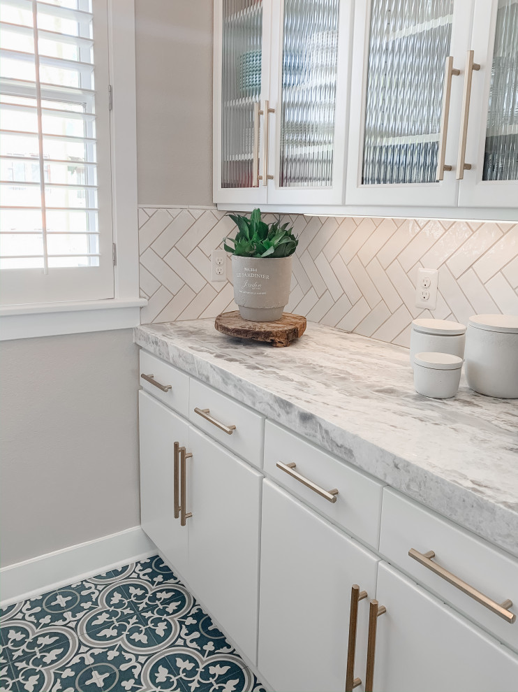 Inspiration for a mid-sized transitional u-shaped medium tone wood floor open concept kitchen remodel in Denver with a farmhouse sink, flat-panel cabinets, turquoise cabinets, quartzite countertops, white backsplash, ceramic backsplash, stainless steel appliances and white countertops