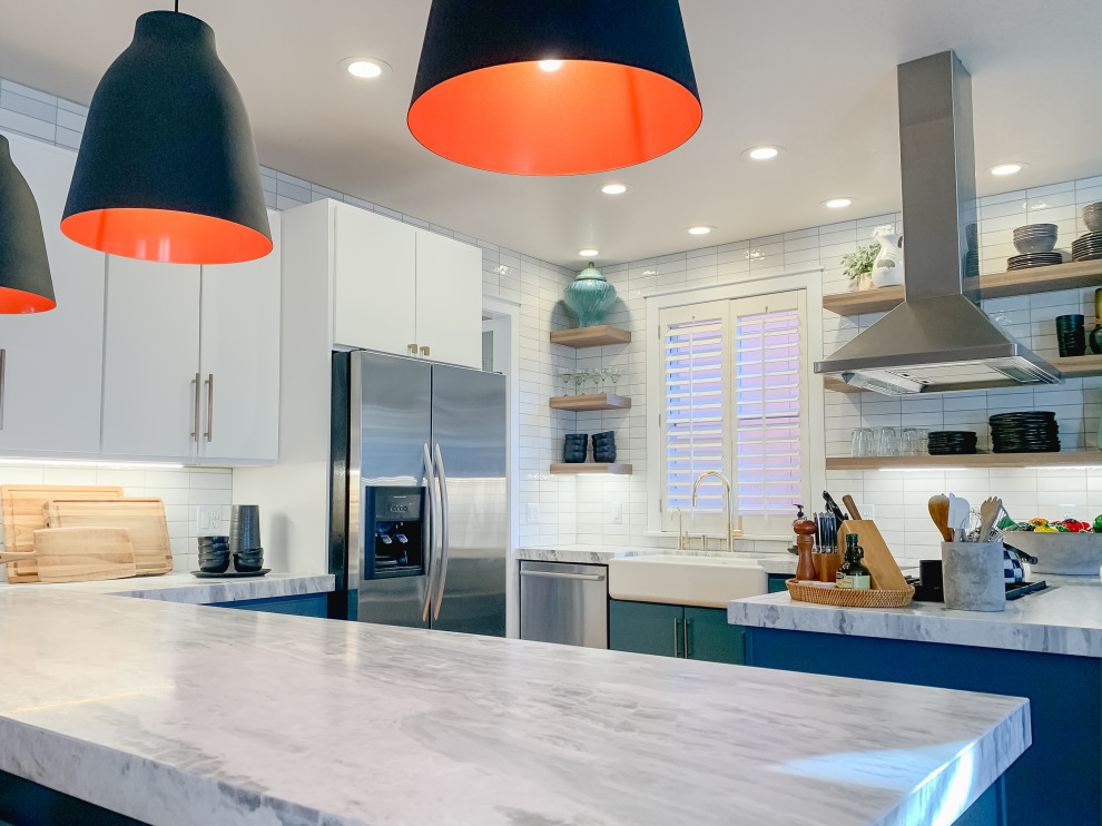 Inspiration for a mid-sized transitional u-shaped medium tone wood floor open concept kitchen remodel in Denver with a farmhouse sink, flat-panel cabinets, turquoise cabinets, quartzite countertops, white backsplash, ceramic backsplash, stainless steel appliances and white countertops