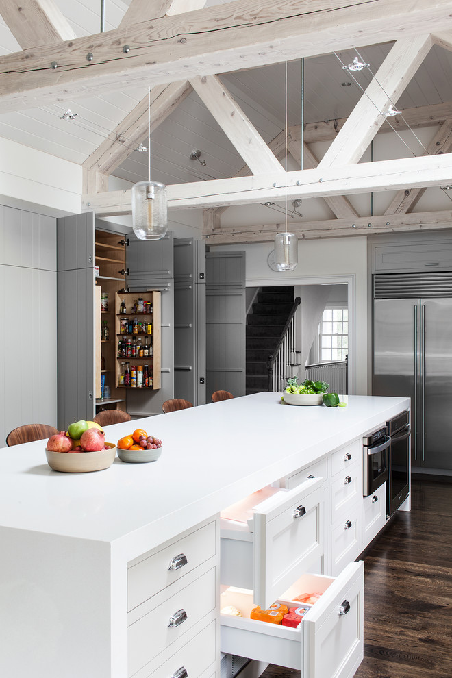This is an example of a traditional kitchen in Boston with recessed-panel cabinets, white cabinets and stainless steel appliances.