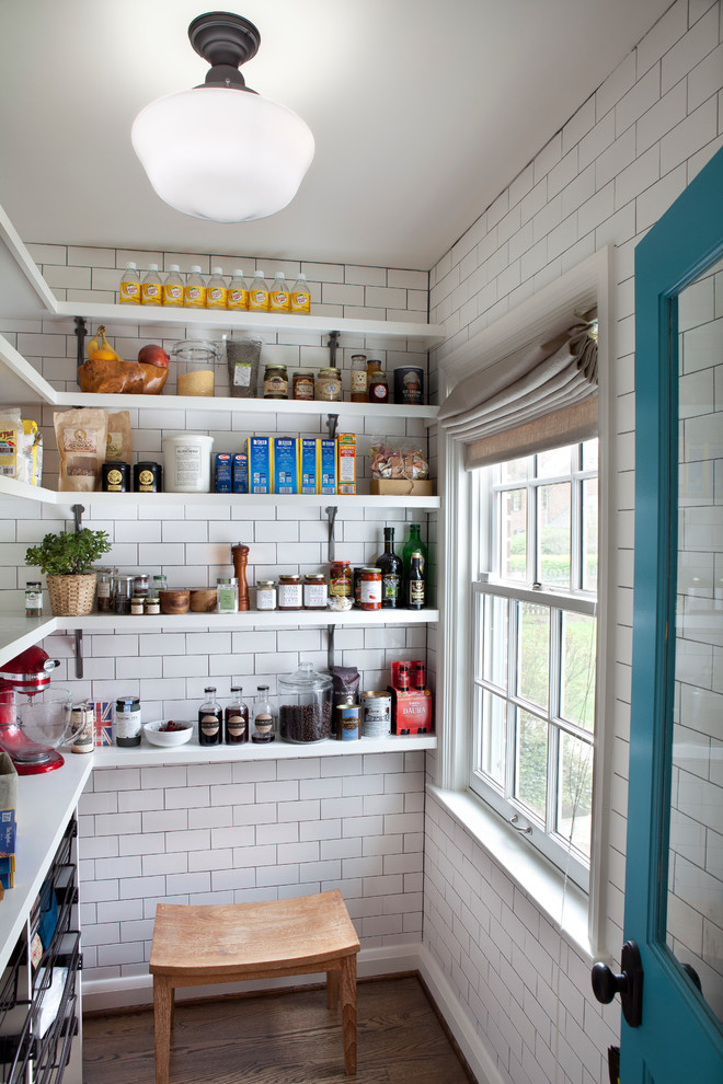 Example of a transitional medium tone wood floor kitchen design in Baltimore with open cabinets, white cabinets, white backsplash and subway tile backsplash