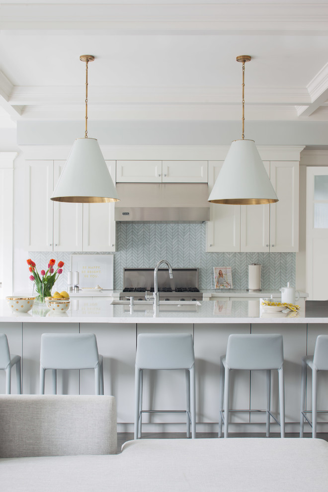 Transitional open concept kitchen photo in Vancouver with shaker cabinets, white cabinets, blue backsplash and an island