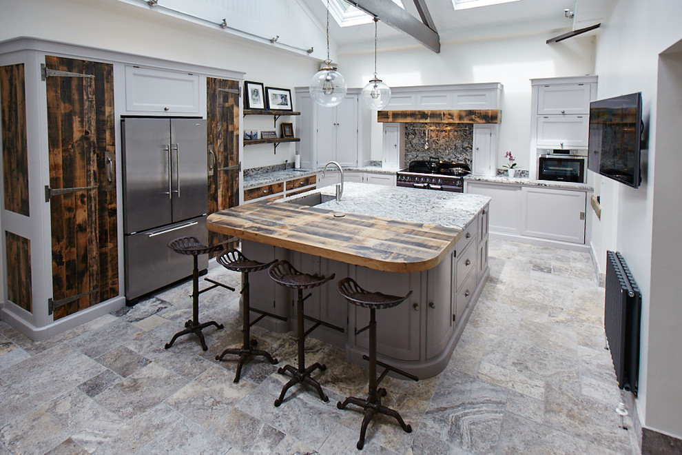 Mid-sized transitional l-shaped multicolored floor kitchen photo in Other with an undermount sink, gray cabinets, granite countertops, stainless steel appliances, an island, recessed-panel cabinets, multicolored backsplash, stone slab backsplash and multicolored countertops