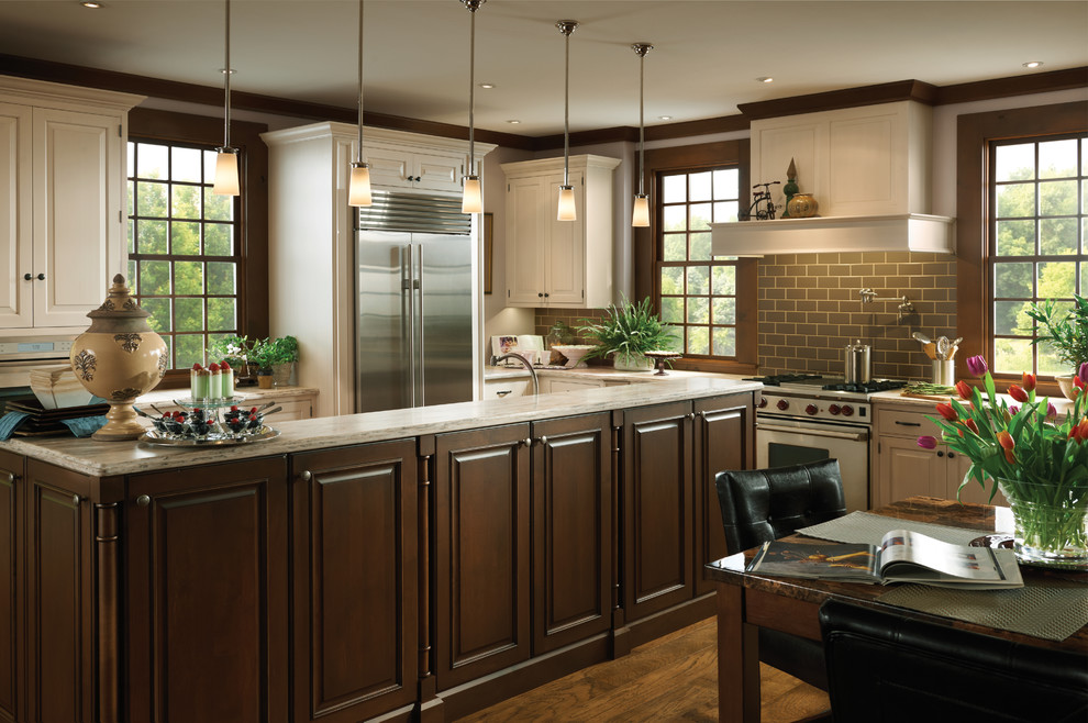 Eat-in kitchen - mid-sized transitional l-shaped medium tone wood floor eat-in kitchen idea in Chicago with raised-panel cabinets, white cabinets, granite countertops, gray backsplash, subway tile backsplash, stainless steel appliances and an island