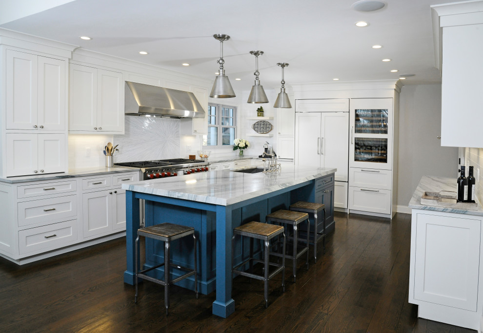 Transitional u-shaped enclosed kitchen photo in New York with flat-panel cabinets, white cabinets, marble countertops, an island and white countertops