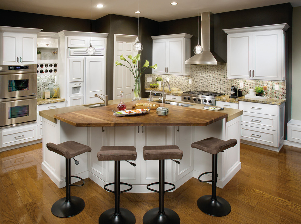 Example of a transitional eat-in kitchen design in Seattle with shaker cabinets, white cabinets and copper countertops