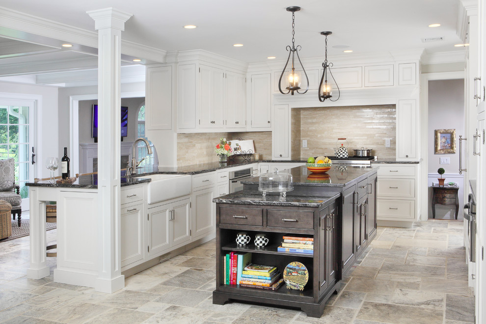 Eat-in kitchen - large transitional l-shaped travertine floor eat-in kitchen idea in New York with beaded inset cabinets, a farmhouse sink, granite countertops, white cabinets, beige backsplash, an island, stainless steel appliances and travertine backsplash