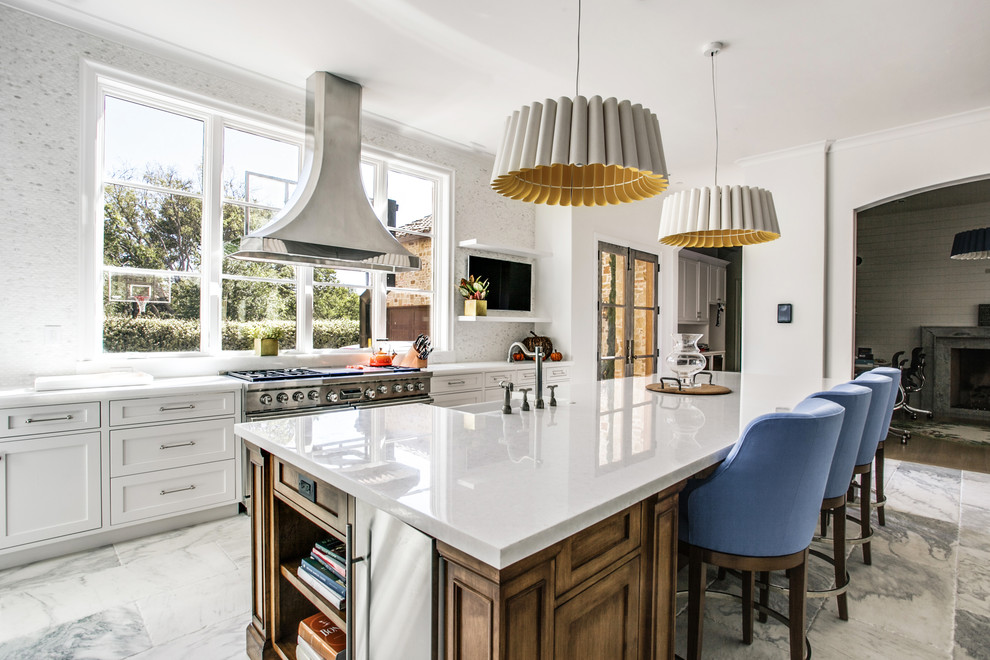 Design ideas for an expansive traditional single-wall open plan kitchen in Dallas with a belfast sink, shaker cabinets, white cabinets, marble worktops, white splashback, mosaic tiled splashback, stainless steel appliances, marble flooring and an island.