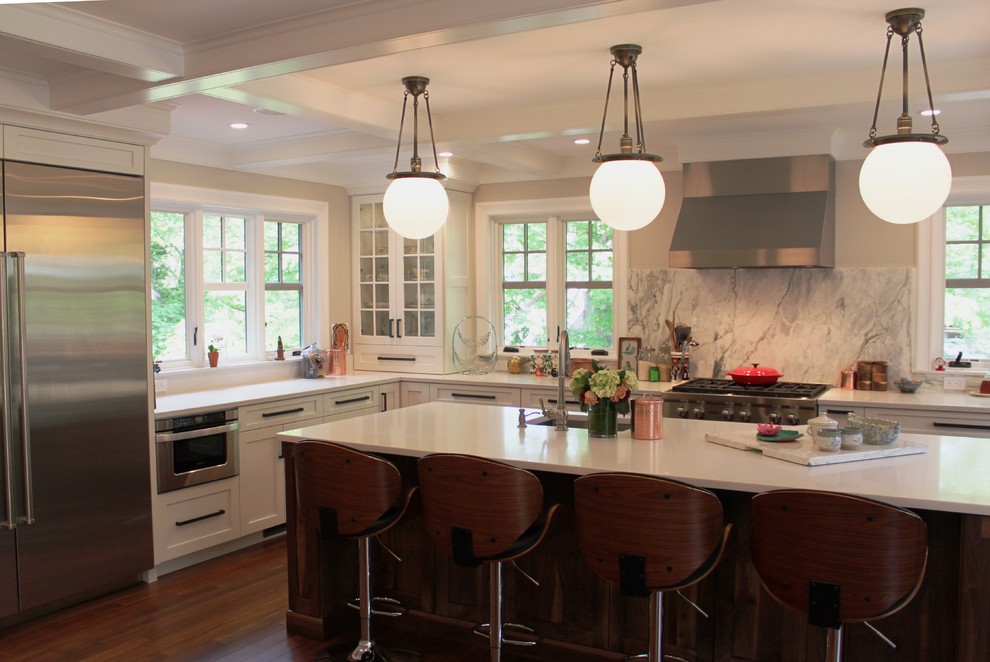 Eat-in kitchen - mid-sized transitional u-shaped dark wood floor eat-in kitchen idea in Boston with a farmhouse sink, shaker cabinets, white cabinets, quartz countertops, gray backsplash, stone slab backsplash, stainless steel appliances and an island
