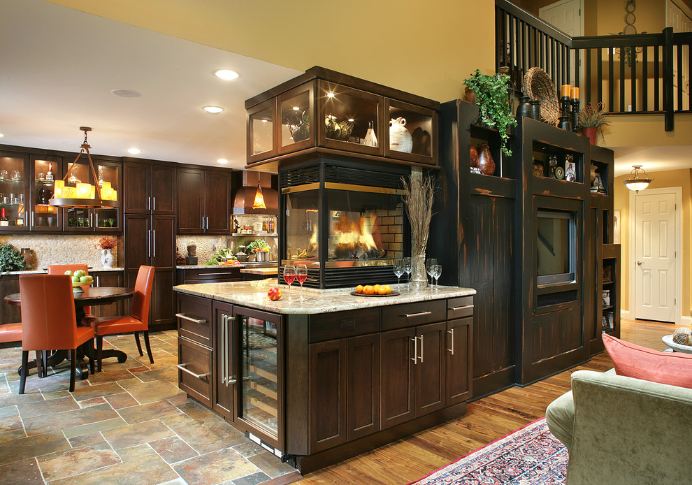 Photo of a traditional kitchen/diner in New York with shaker cabinets, dark wood cabinets, granite worktops and slate flooring.