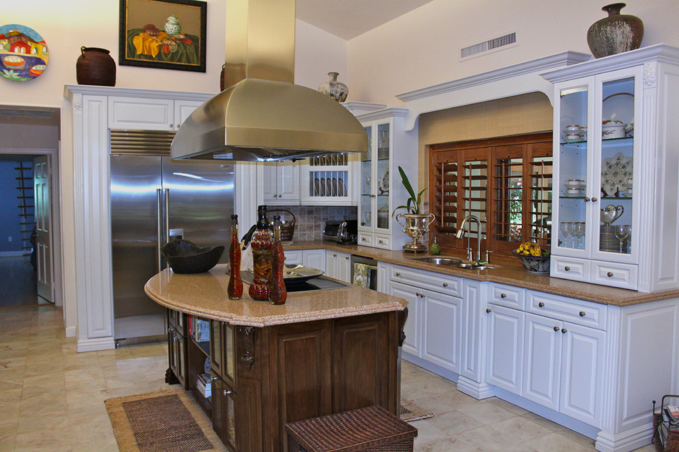 Photo of a world-inspired kitchen in Miami with stainless steel appliances.