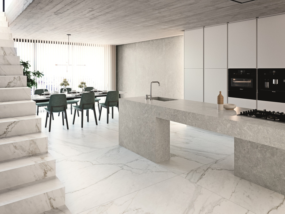 Esempio di una grande cucina minimalista con top in superficie solida, pavimento in gres porcellanato e top grigio