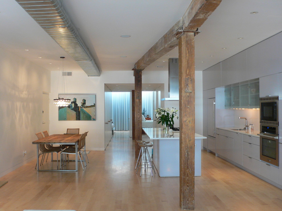 This is an example of a contemporary open plan kitchen in New York.