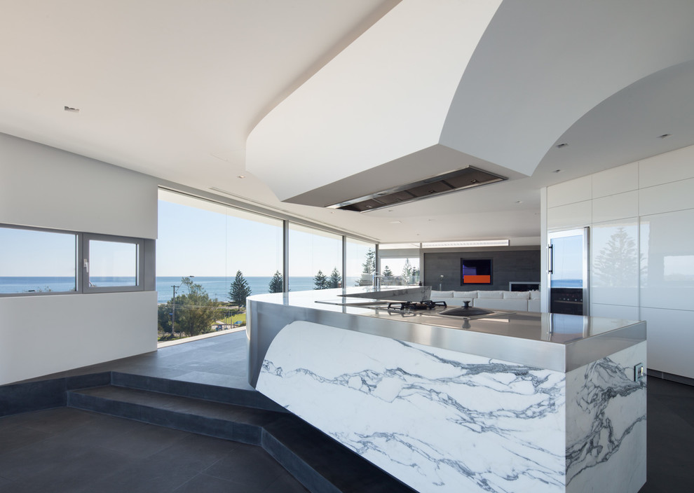 Inspiration for a contemporary open concept kitchen remodel in Perth with a double-bowl sink, flat-panel cabinets, white cabinets, marble countertops and stainless steel appliances