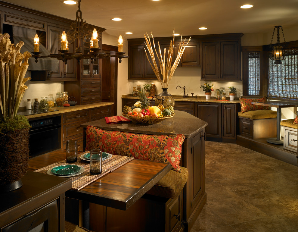 Large island style l-shaped ceramic tile open concept kitchen photo in Other with an undermount sink, raised-panel cabinets, dark wood cabinets, granite countertops, black appliances and an island