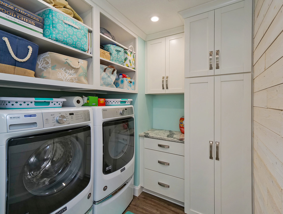 Example of a large island style vinyl floor laundry room design in Jacksonville with shaker cabinets, white cabinets, quartz countertops, white backsplash, ceramic backsplash and gray countertops