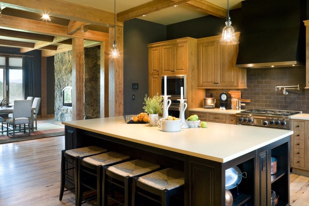Example of a mountain style kitchen design in Portland with subway tile backsplash
