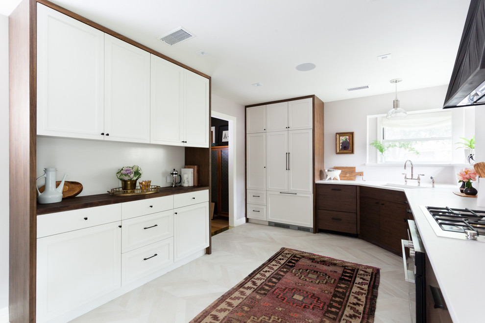 Inspiration for a mid-sized eclectic galley porcelain tile and beige floor eat-in kitchen remodel in Austin with a double-bowl sink, flat-panel cabinets, dark wood cabinets, quartz countertops, stainless steel appliances and no island