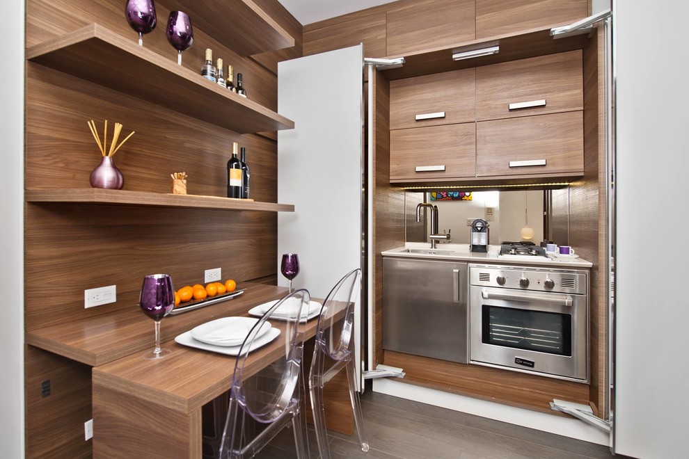 Eat-in kitchen - small modern l-shaped concrete floor and brown floor eat-in kitchen idea in New York with an undermount sink, flat-panel cabinets, light wood cabinets, wood countertops, brown backsplash, wood backsplash, stainless steel appliances and no island
