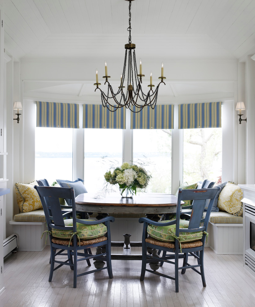 Beach style eat-in kitchen photo in Chicago with white cabinets
