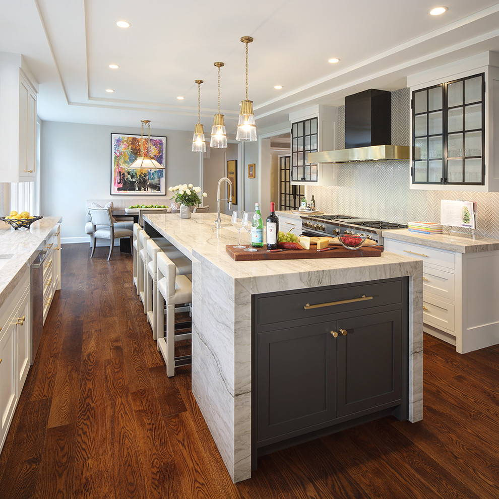 Design ideas for a classic kitchen/diner in Cleveland with stainless steel appliances, dark hardwood flooring, an island, brown floors and shaker cabinets.