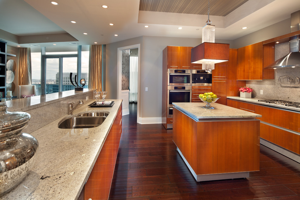 Example of a trendy u-shaped open concept kitchen design in DC Metro with an undermount sink, flat-panel cabinets, medium tone wood cabinets, gray backsplash and stainless steel appliances