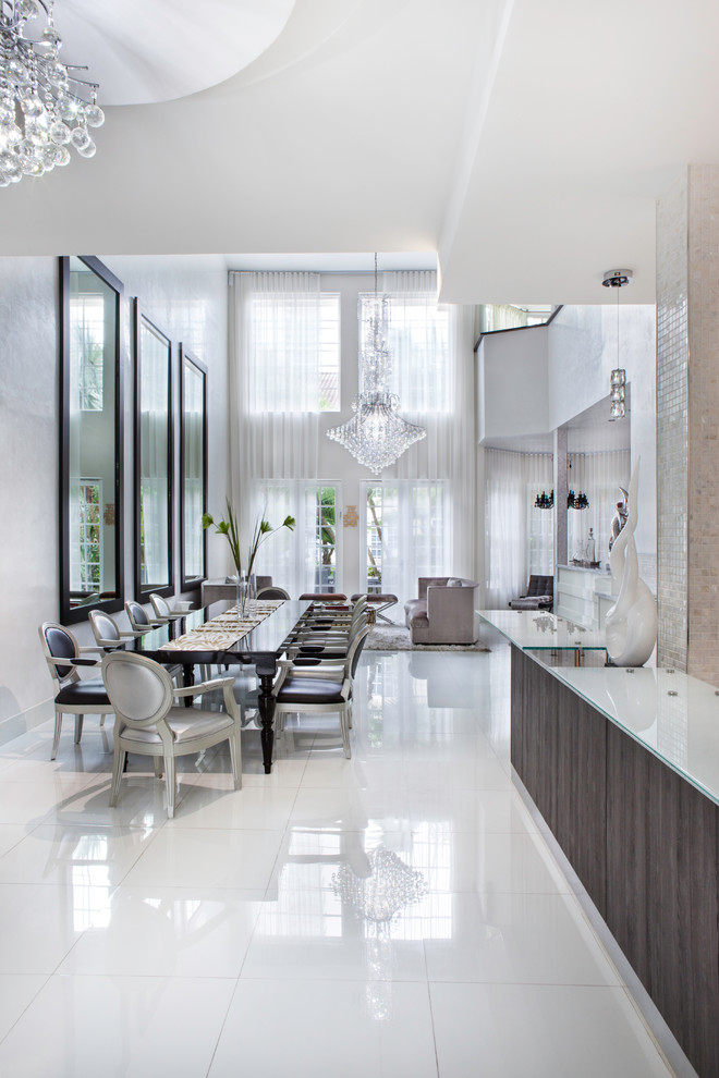 Eat-in kitchen - huge modern l-shaped marble floor eat-in kitchen idea in Miami with flat-panel cabinets, white cabinets, quartz countertops, white backsplash, mosaic tile backsplash, stainless steel appliances, an island and a double-bowl sink