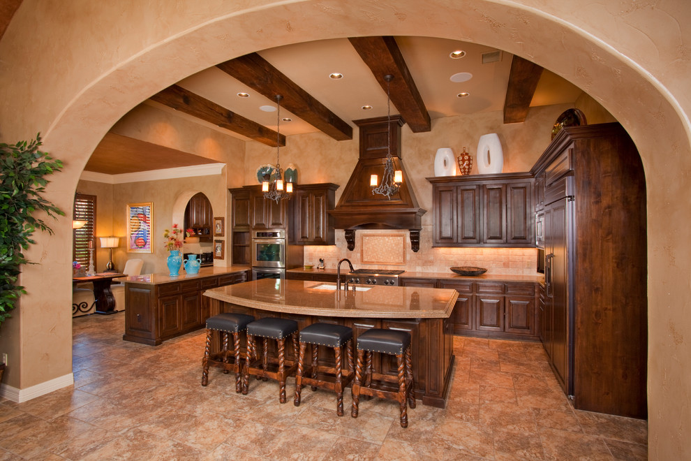 Tuscan kitchen photo in Austin with paneled appliances and granite countertops