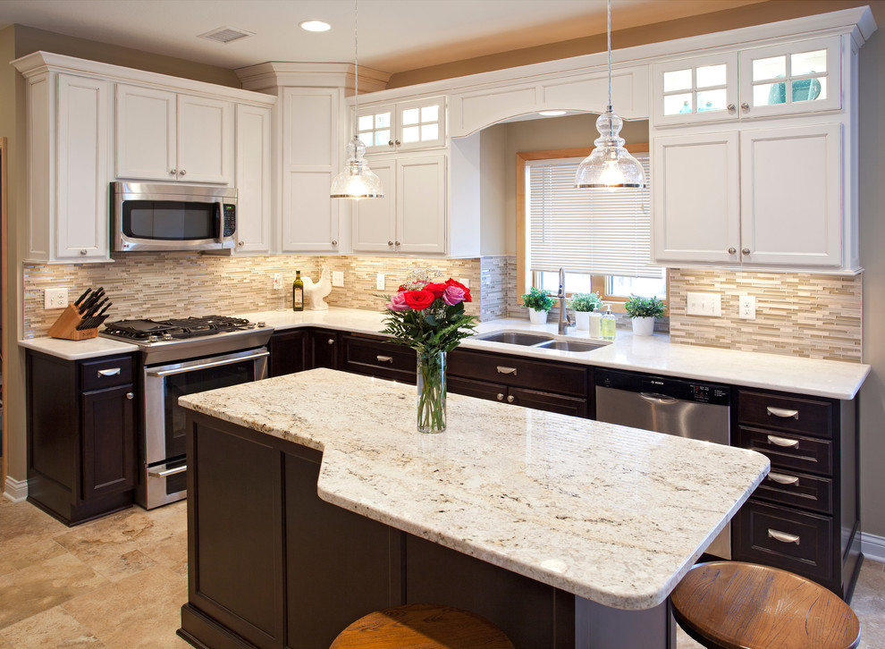 Inspiration for a mid-sized timeless u-shaped marble floor eat-in kitchen remodel in Minneapolis with an undermount sink, raised-panel cabinets, white cabinets, granite countertops, multicolored backsplash, matchstick tile backsplash, stainless steel appliances and an island