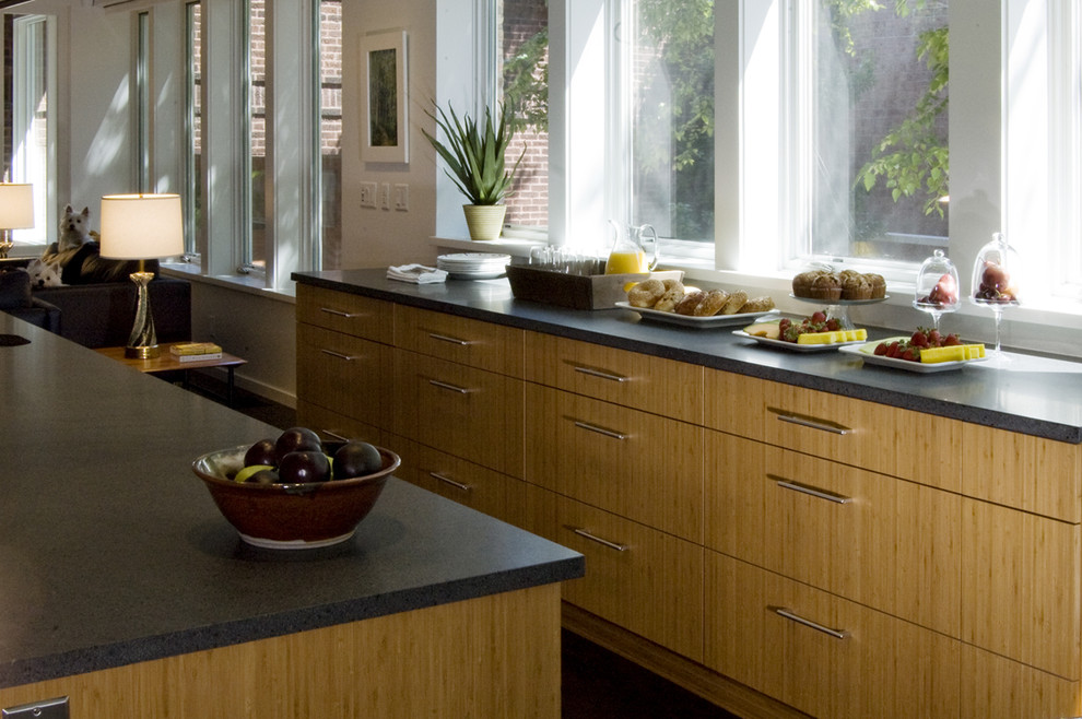 Contemporary kitchen in Chicago with flat-panel cabinets and medium wood cabinets.