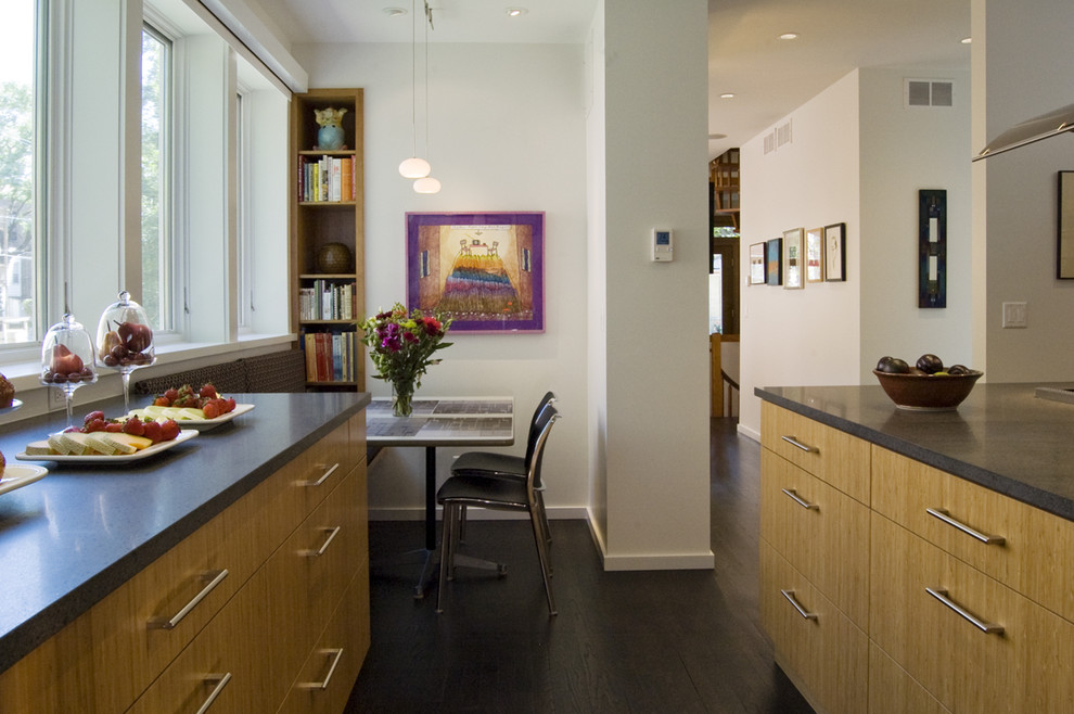 Trendy eat-in kitchen photo in Chicago with flat-panel cabinets and medium tone wood cabinets