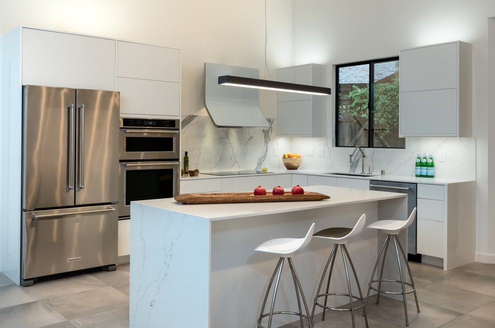 Photo of a contemporary l-shaped kitchen in Other with engineered stone countertops, stone slab splashback and an island.