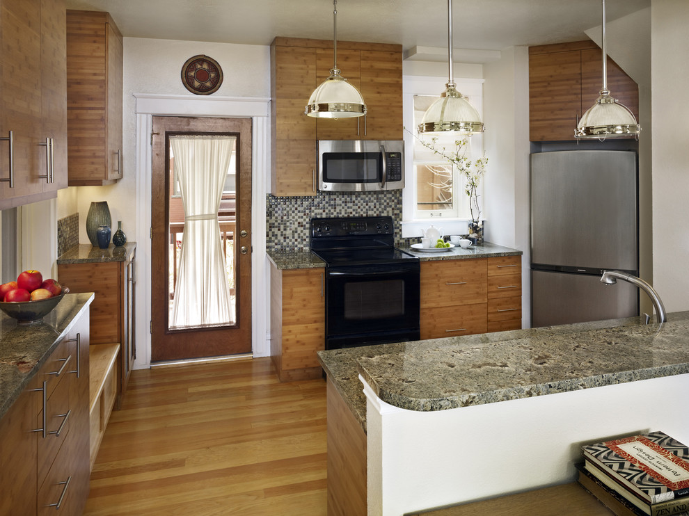 This is an example of a contemporary kitchen in Denver with black appliances.