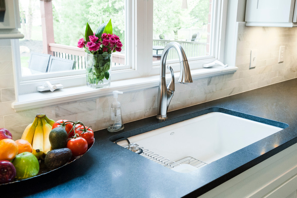 Undermount sink with satin nickel faucet and marble subway tile