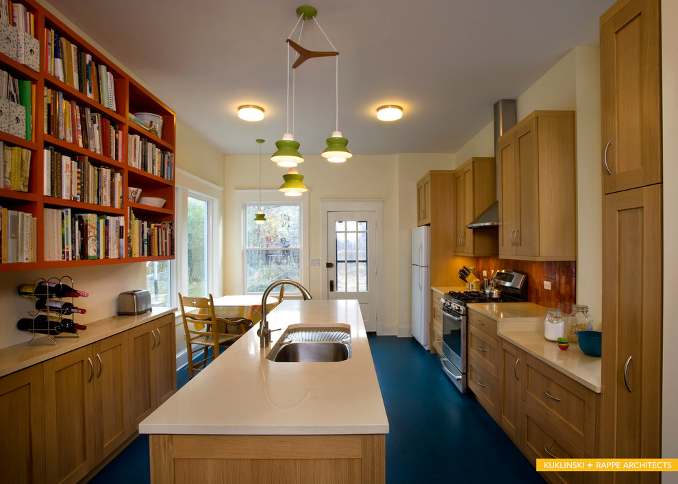 Example of a mid-sized trendy galley linoleum floor enclosed kitchen design in Chicago with an undermount sink, shaker cabinets, light wood cabinets, quartz countertops, orange backsplash, ceramic backsplash, stainless steel appliances and an island