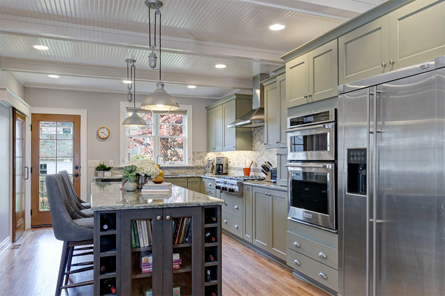 Eat-in kitchen - large traditional single-wall medium tone wood floor eat-in kitchen idea in Columbus with an undermount sink, shaker cabinets, green cabinets, quartzite countertops, multicolored backsplash, mosaic tile backsplash, stainless steel appliances and an island