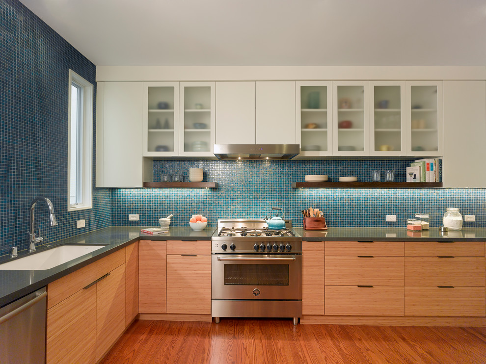 Mid-sized trendy l-shaped medium tone wood floor and brown floor kitchen photo in San Francisco with an undermount sink, flat-panel cabinets, light wood cabinets, quartz countertops, blue backsplash, mosaic tile backsplash, stainless steel appliances, no island and gray countertops